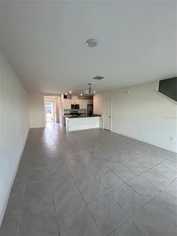 a view of a livingroom with a kitchen