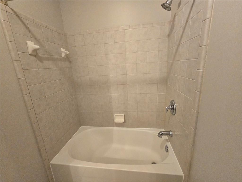 624 Maple Grove Way Marietta, GA 30066 - Photo 22 of 27 a white bath tub sitting in a bathroom