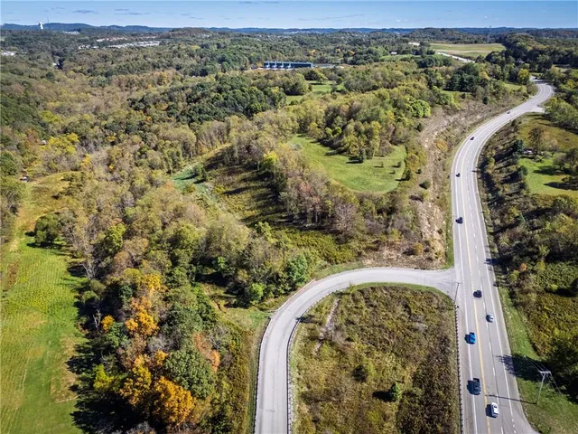 a view of a yard with wooden fence