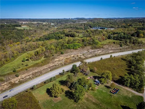 an aerial view of a yard with horses