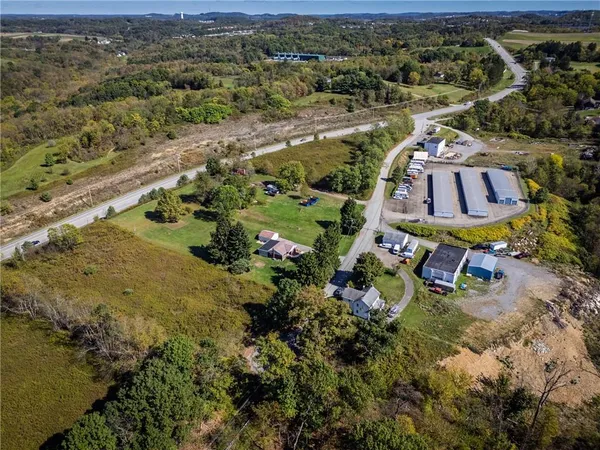 an aerial view of residential house with outdoor space
