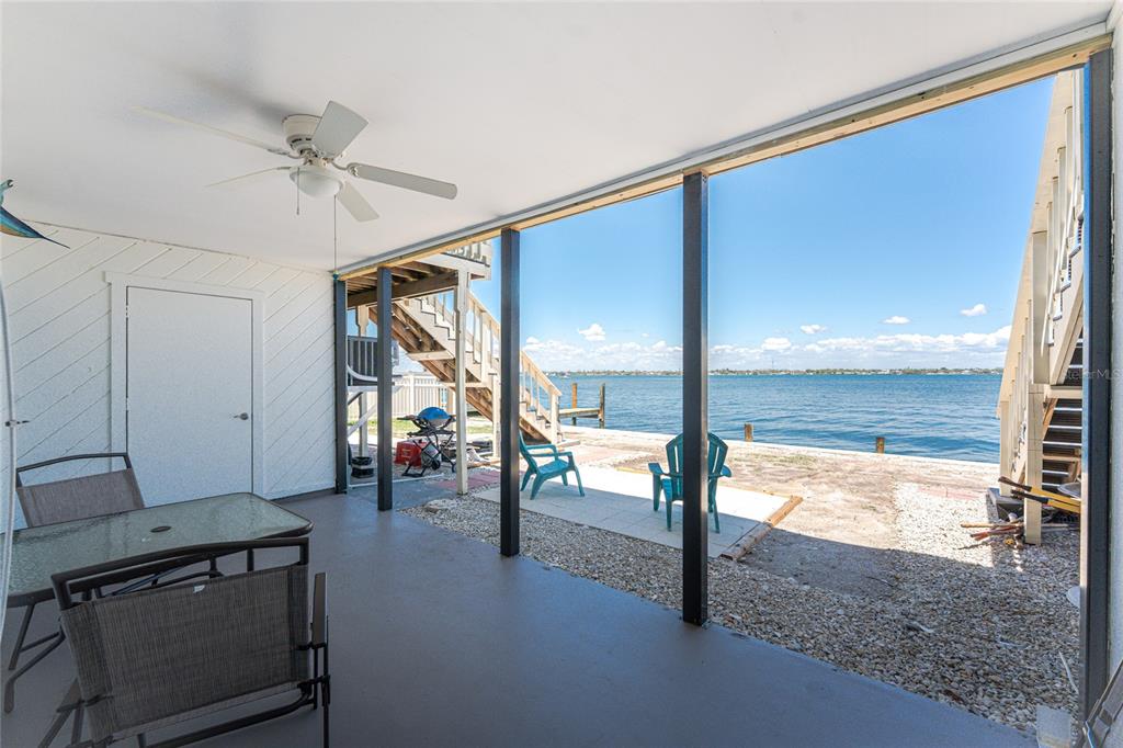 5041 North Beach Road, Unit 2A AND 2B Englewood, FL 34223 - Photo 26 of 90 a view of an empty room and floor to ceiling window