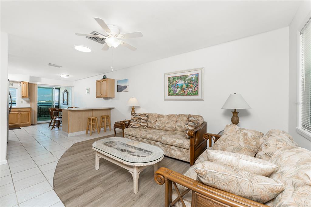 5041 North Beach Road, Unit 2A AND 2B Englewood, FL 34223 - Photo 36 of 90 a living room with furniture and a chandelier