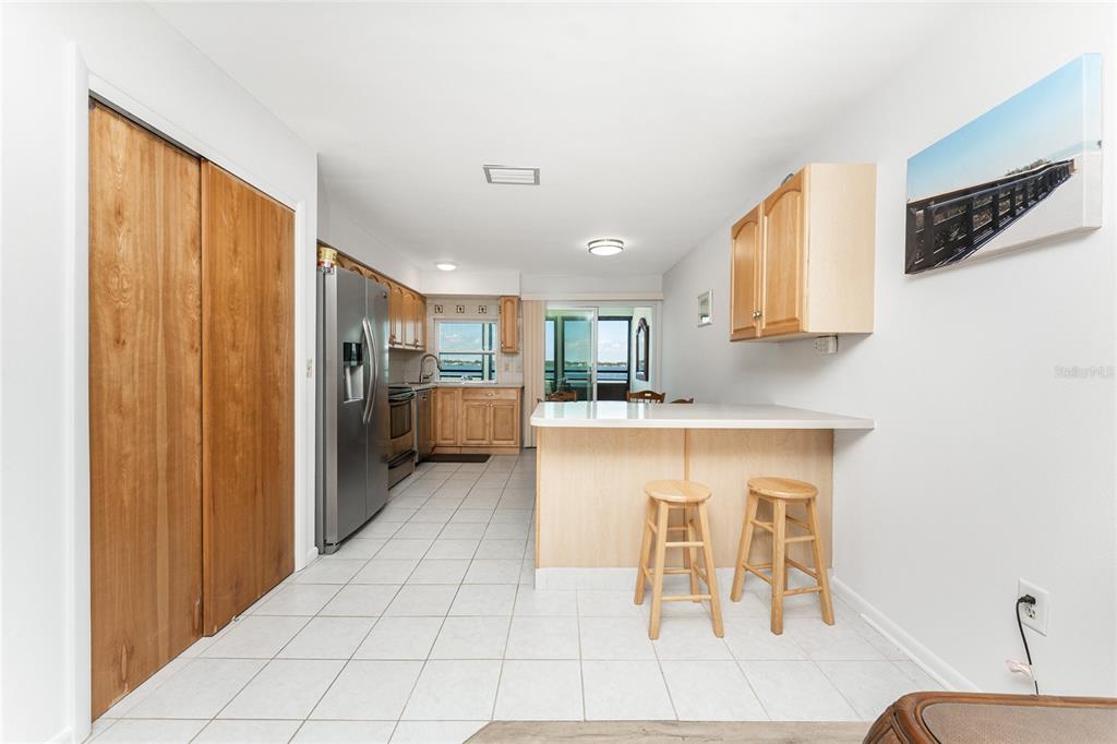 5041 North Beach Road, Unit 2A AND 2B Englewood, FL 34223 - Photo 38 of 90 a kitchen with stainless steel appliances granite countertop a refrigerator and a stove top oven
