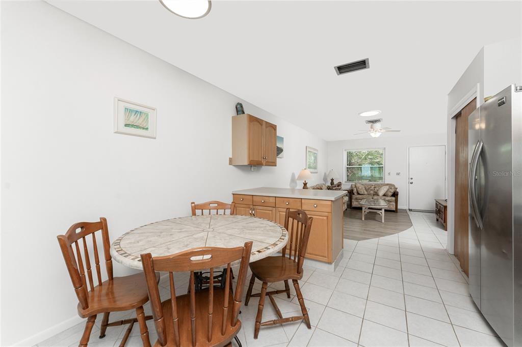 5041 North Beach Road, Unit 2A AND 2B Englewood, FL 34223 - Photo 42 of 90 a view of a dining room with furniture