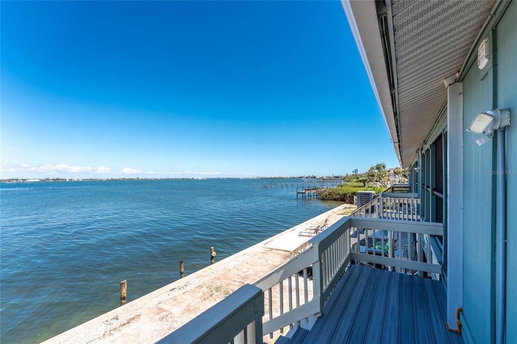 5041 North Beach Road, Unit 2A AND 2B Englewood, FL 34223 - Photo 48 of 90 a view of roof deck with ocean view and wooden floor