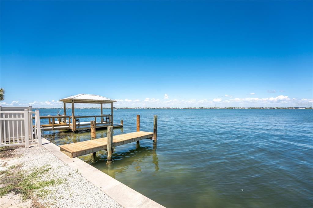 5041 North Beach Road, Unit 2A AND 2B Englewood, FL 34223 - Photo 58 of 90 a view of a swimming pool with outdoor seating
