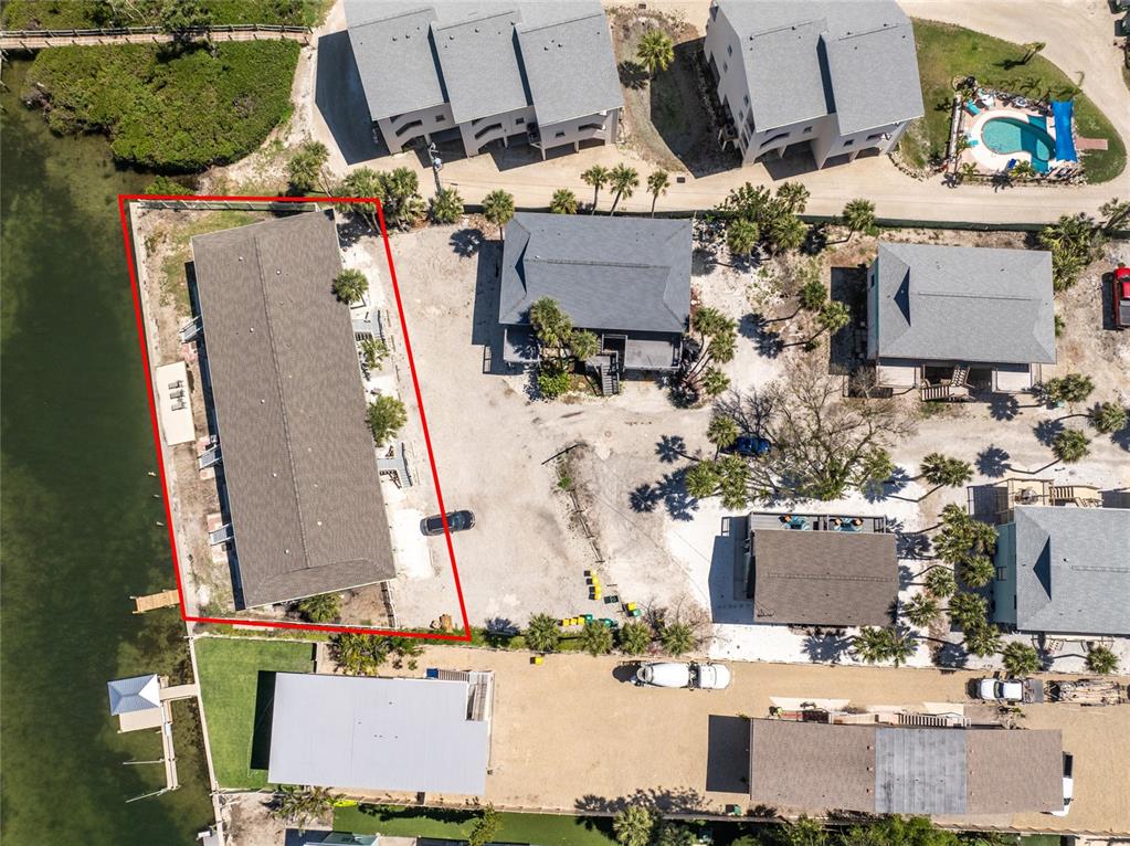 5041 North Beach Road, Unit 2A AND 2B Englewood, FL 34223 - Photo 76 of 90 an aerial view of residential houses with outdoor space