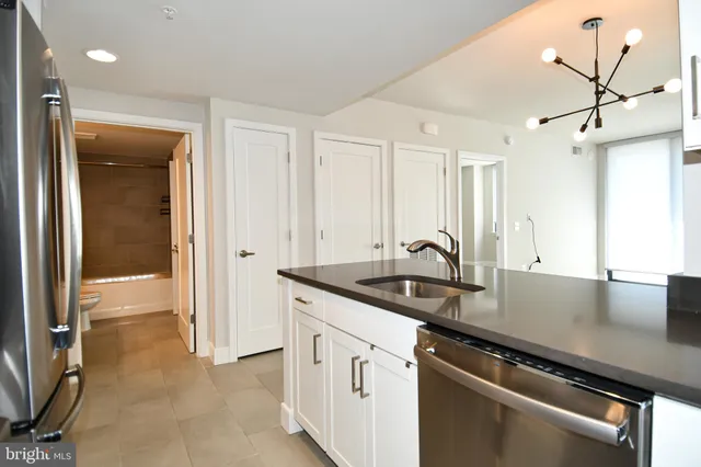 a view of a kitchen counter space and windows