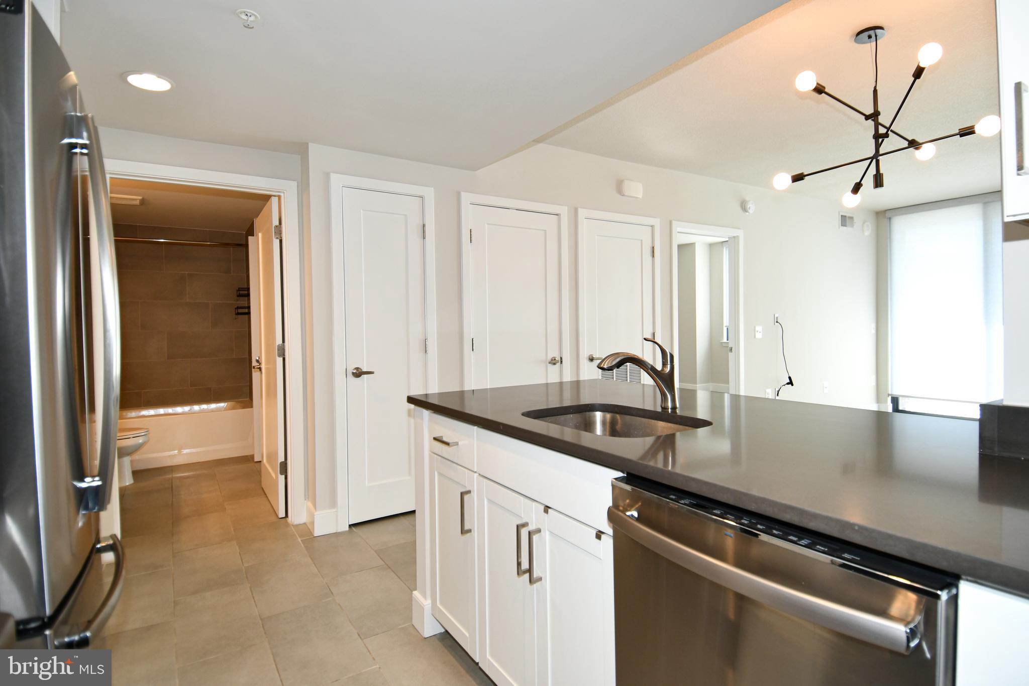50 Florida Avenue Northeast, Unit 523 Washington, DC 20002 - Photo 15 of 38 a view of a kitchen counter space and windows