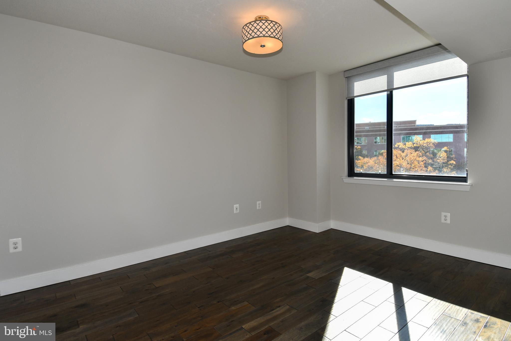 50 Florida Avenue Northeast, Unit 523 Washington, DC 20002 - Photo 17 of 38 a view of a room with wooden floor and a window