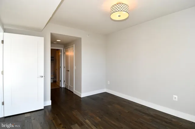 a view of a room with wooden floor