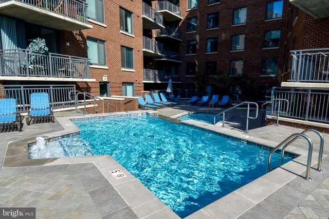 a view of a swimming pool with a patio