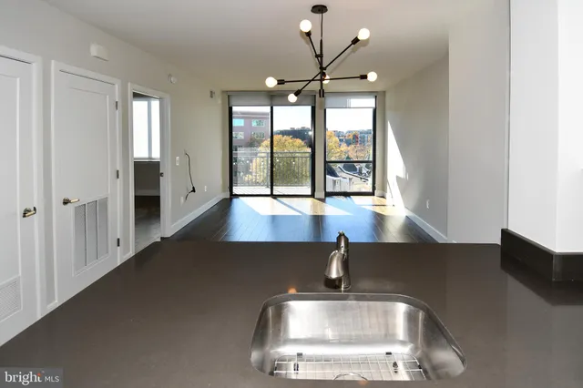 a view of staircase with open kitchen