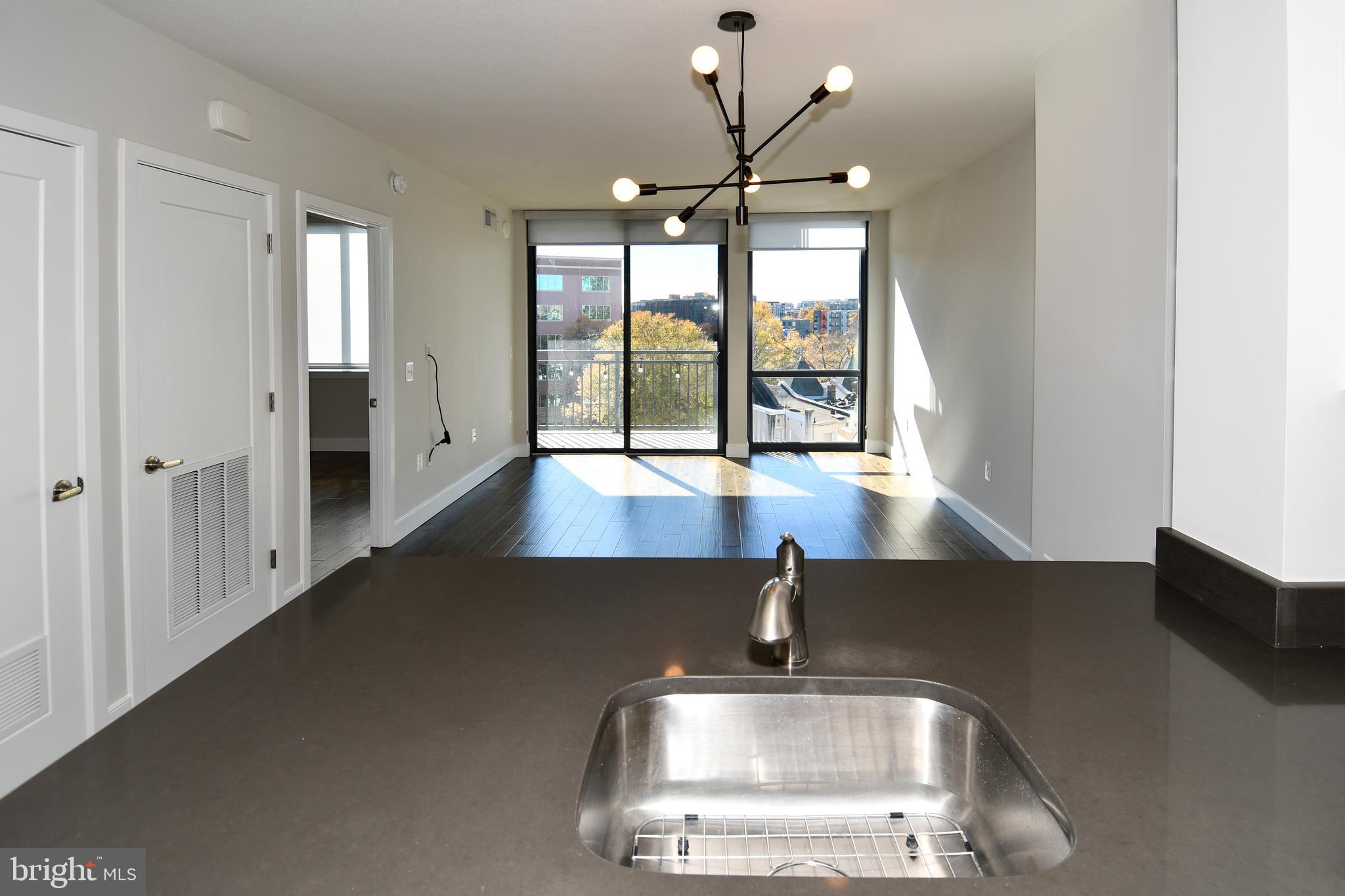 50 Florida Avenue Northeast, Unit 523 Washington, DC 20002 - Photo 8 of 38 a view of staircase with open kitchen