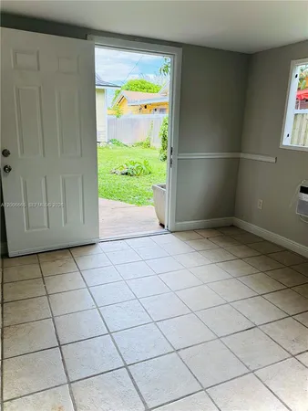 a view of an empty room and window