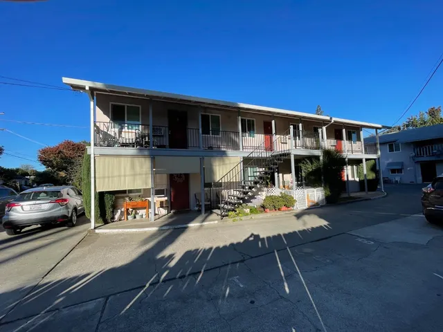 a view of a car parked in front of a building