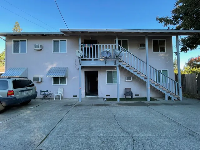 a view of a car park in front of house