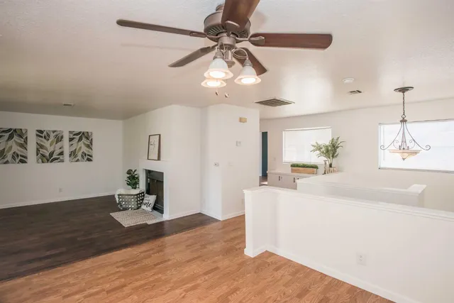 a kitchen with stainless steel appliances granite countertop a refrigerator a stove and a sink