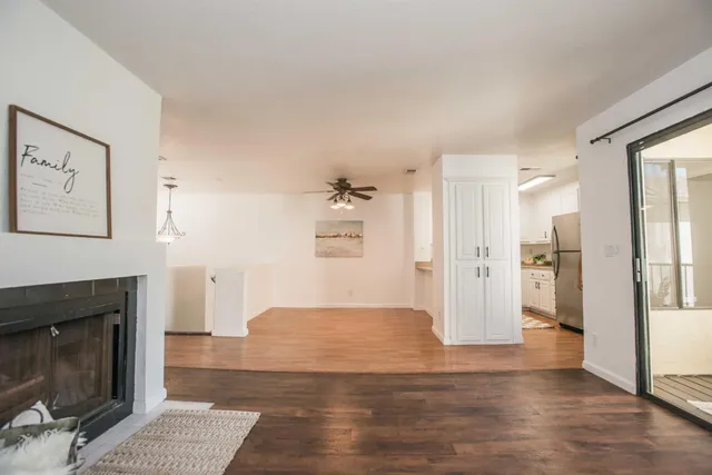 a view of empty room with a fireplace