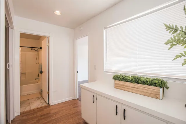 a bathroom with a sink toilet a mirror and shower