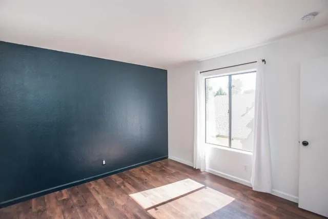 a view of balcony with wooden floor