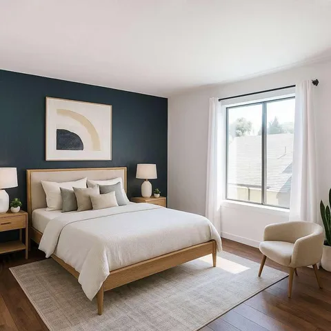 a bedroom with a bed and windows