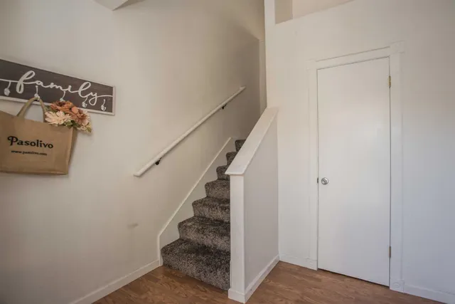 a living room with a bed furniture and a window