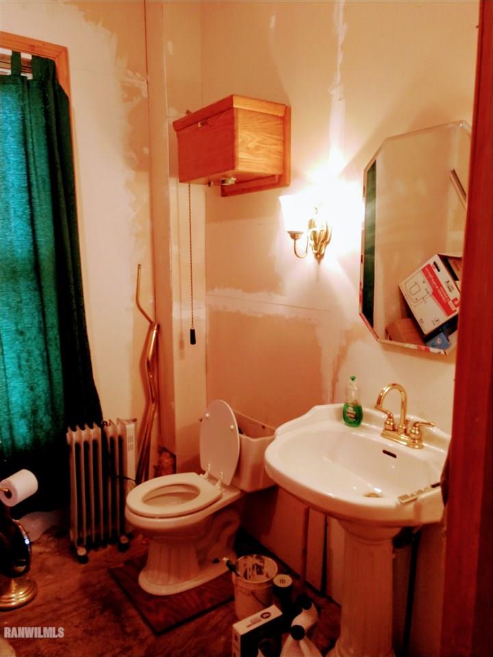 19129 Cyclone Ridge Road Mount Carroll, IL 61053 - Photo 14 of 33 a bathroom with a sink toilet and mirror