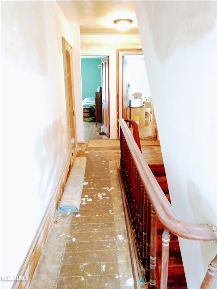 19129 Cyclone Ridge Road Mount Carroll, IL 61053 - Photo 17 of 33 a view of a hallway with wooden floor and staircase