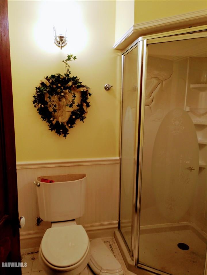 19129 Cyclone Ridge Road Mount Carroll, IL 61053 - Photo 23 of 33 a bathroom with a toilet and a shower