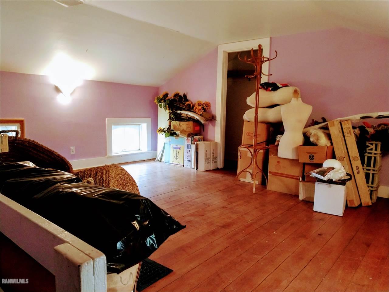 19129 Cyclone Ridge Road Mount Carroll, IL 61053 - Photo 26 of 33 a bed room with a bed and a chair