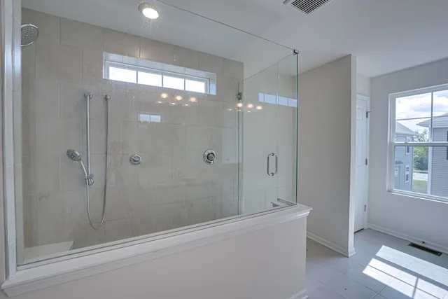 a bathroom with a shower and a bathtub