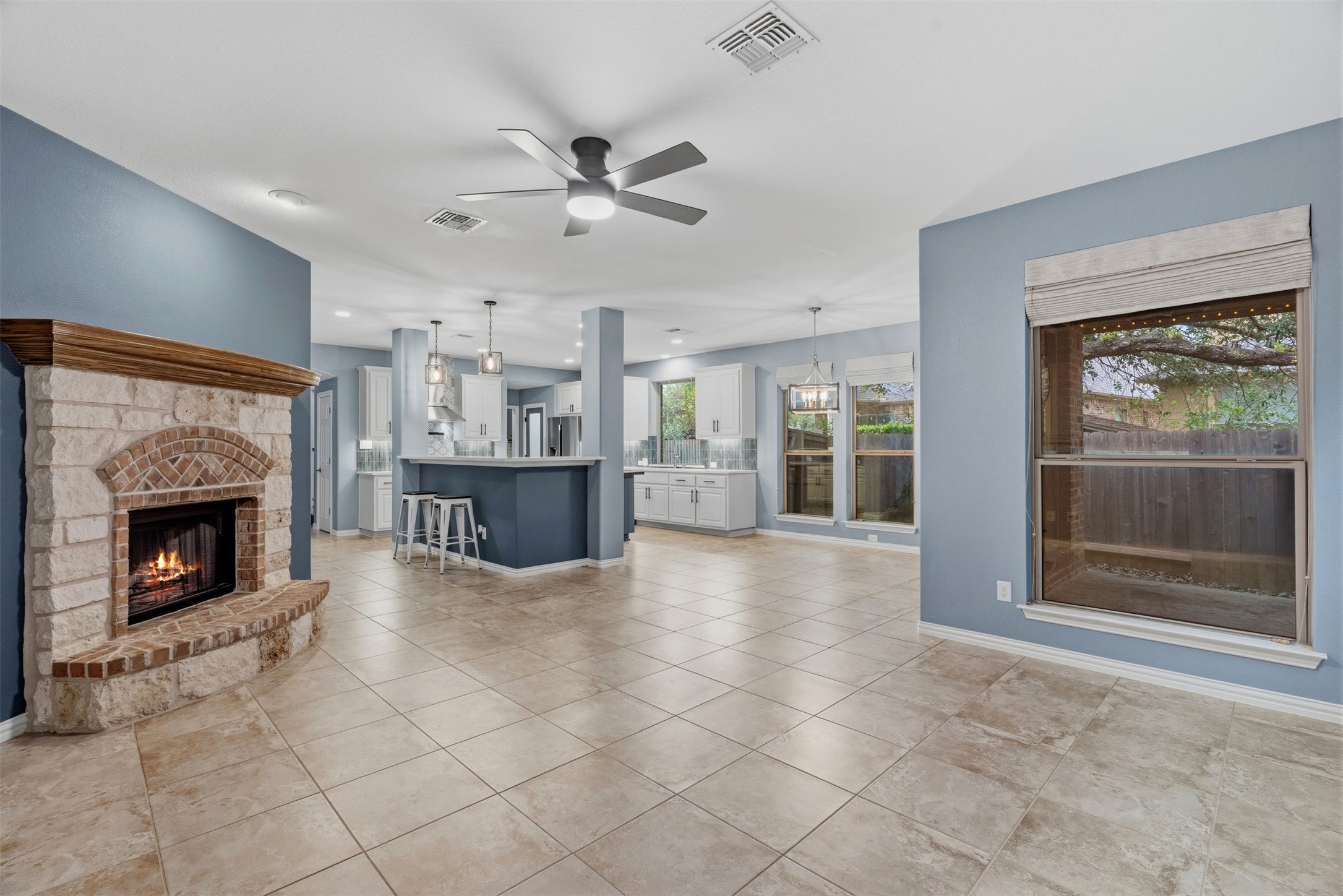 3935 Bowstring Bend Cedar Park, TX 78613 - Photo 18 of 39 The comfortable living room is anchored by a corner fireplace, perfect for cozy evenings