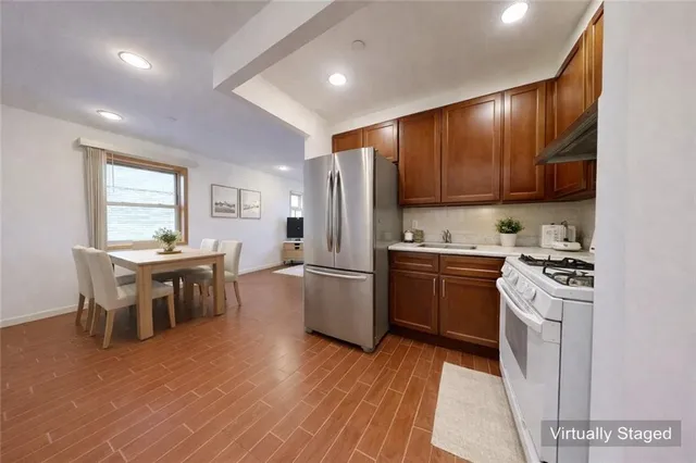 a kitchen with a sink and a stove top oven