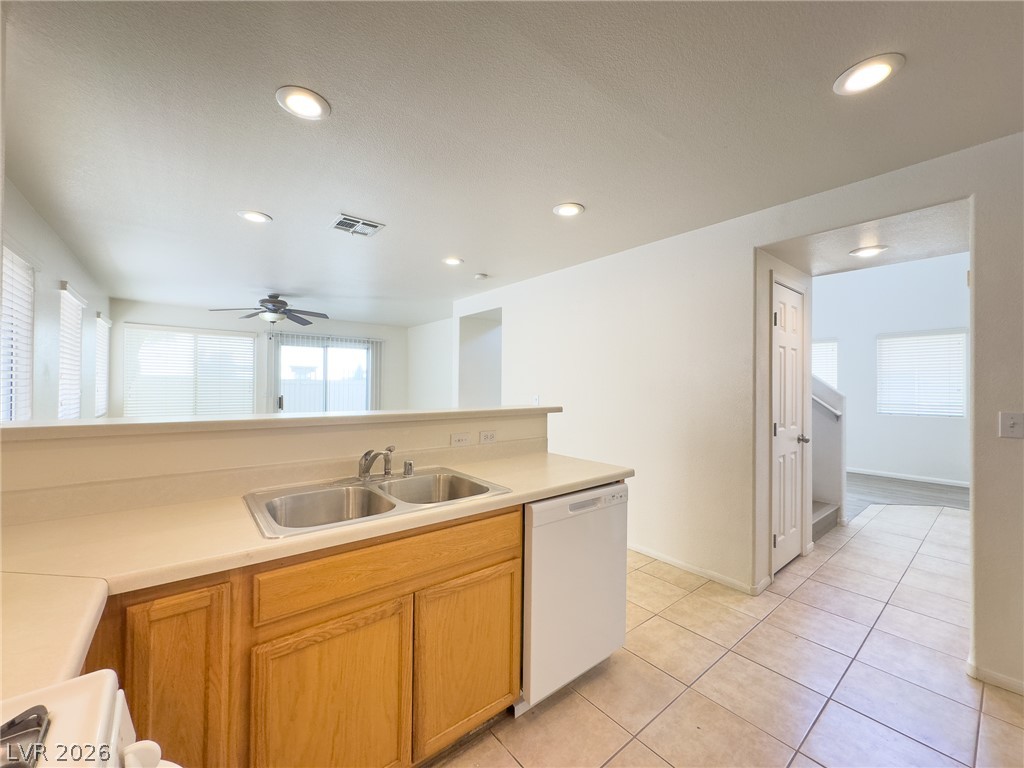 9456 Grandview Spring Avenue Las Vegas, NV 89166 - Photo 17 of 49 A well-equipped kitchen offers seamless flow into the adjacent living area, ideal for relaxed entertaining.