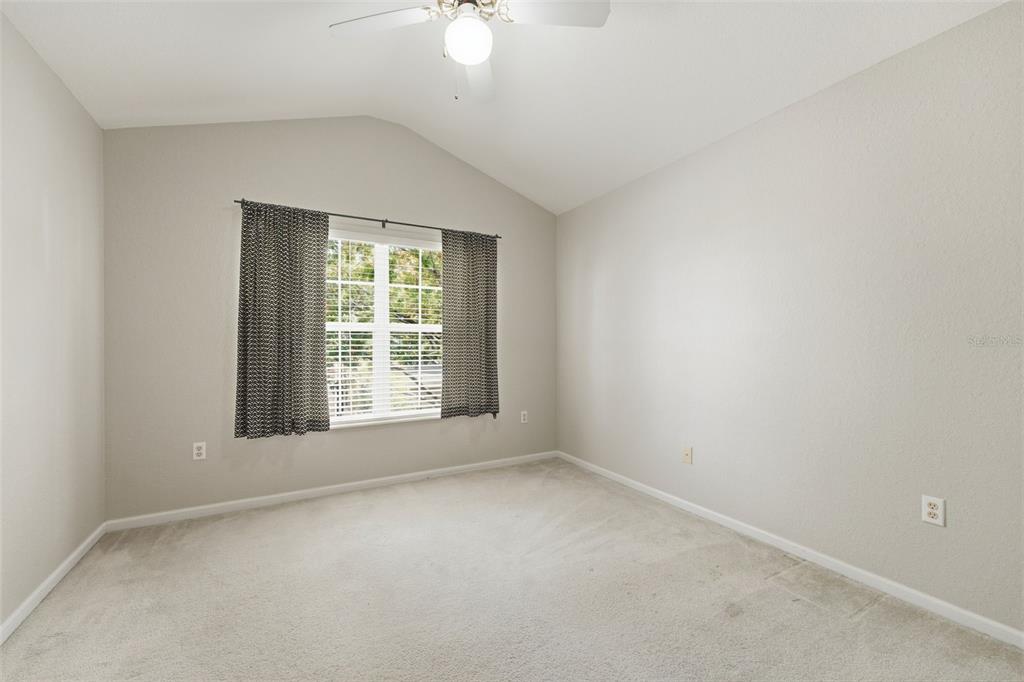 2838 Villafuerte Point, Unit 107 Orlando, FL 32835 - Photo 14 of 27 an empty room with a window