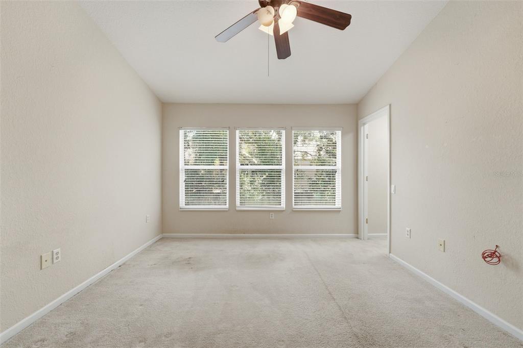 2838 Villafuerte Point, Unit 107 Orlando, FL 32835 - Photo 16 of 27 a view of an empty room with a window