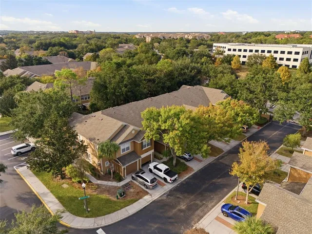 an aerial view of a house with a garden