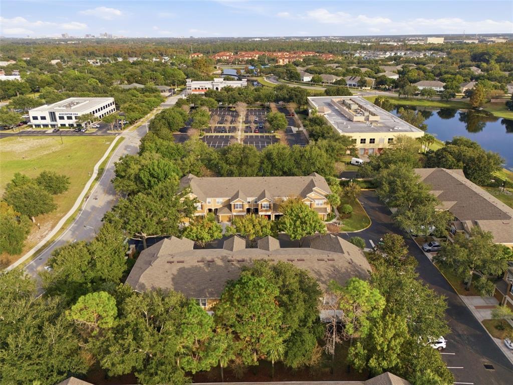 2838 Villafuerte Point, Unit 107 Orlando, FL 32835 - Photo 24 of 27 an aerial view of residential houses with outdoor space