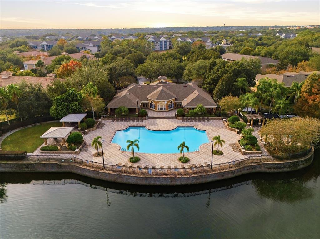 2838 Villafuerte Point, Unit 107 Orlando, FL 32835 - Photo 25 of 27 a view of a lake with a mountain