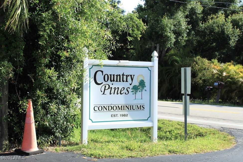 1221 Barrett Road, Unit 905 North Fort Myers, FL 33903 - Photo 1 of 22 a sign on the side of the road