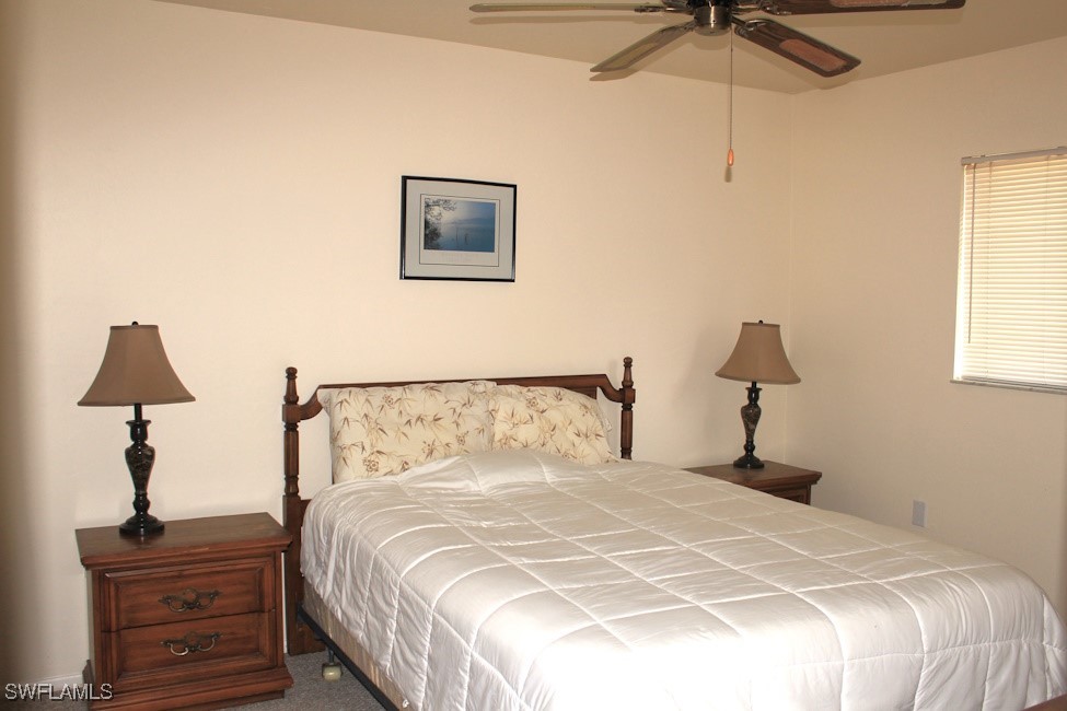 1221 Barrett Road, Unit 905 North Fort Myers, FL 33903 - Photo 13 of 22 a bedroom with a bed and a lamp
