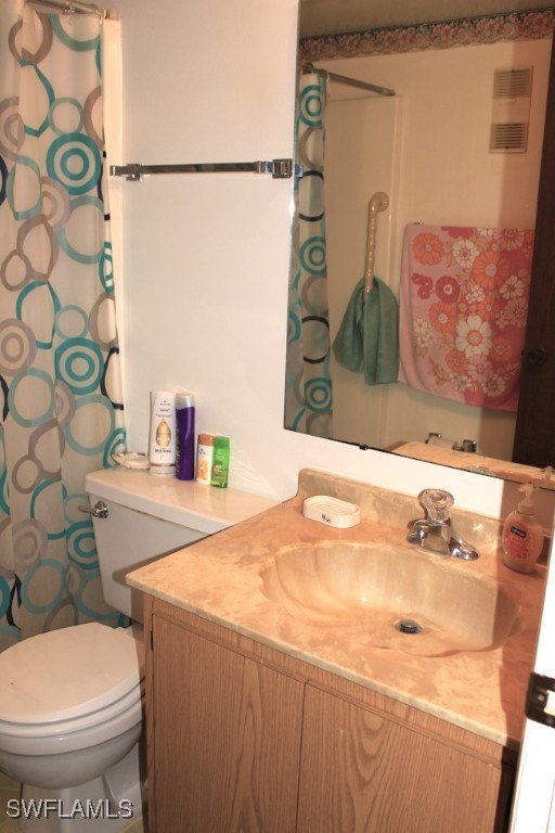 1221 Barrett Road, Unit 905 North Fort Myers, FL 33903 - Photo 15 of 22 a bathroom with a sink toilet and shower
