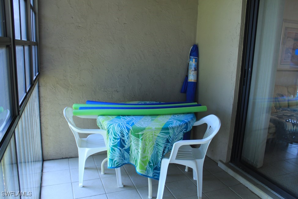 1221 Barrett Road, Unit 905 North Fort Myers, FL 33903 - Photo 18 of 22 a dining room with furniture and a potted plant