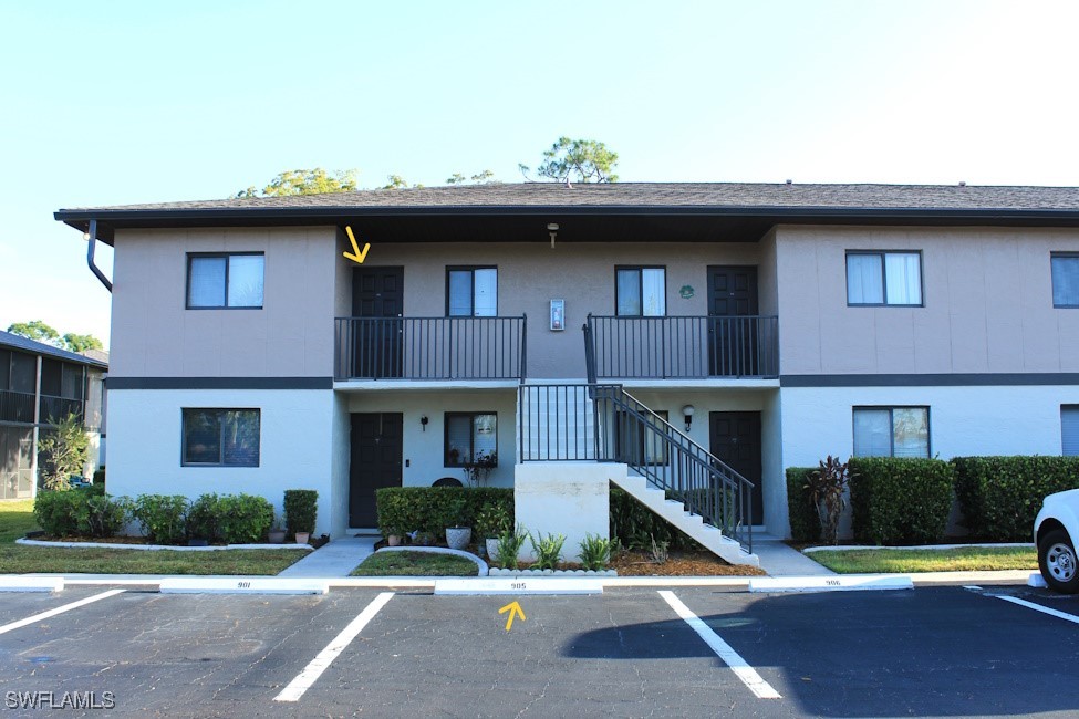 1221 Barrett Road, Unit 905 North Fort Myers, FL 33903 - Photo 2 of 22 a front view of a house with a yard