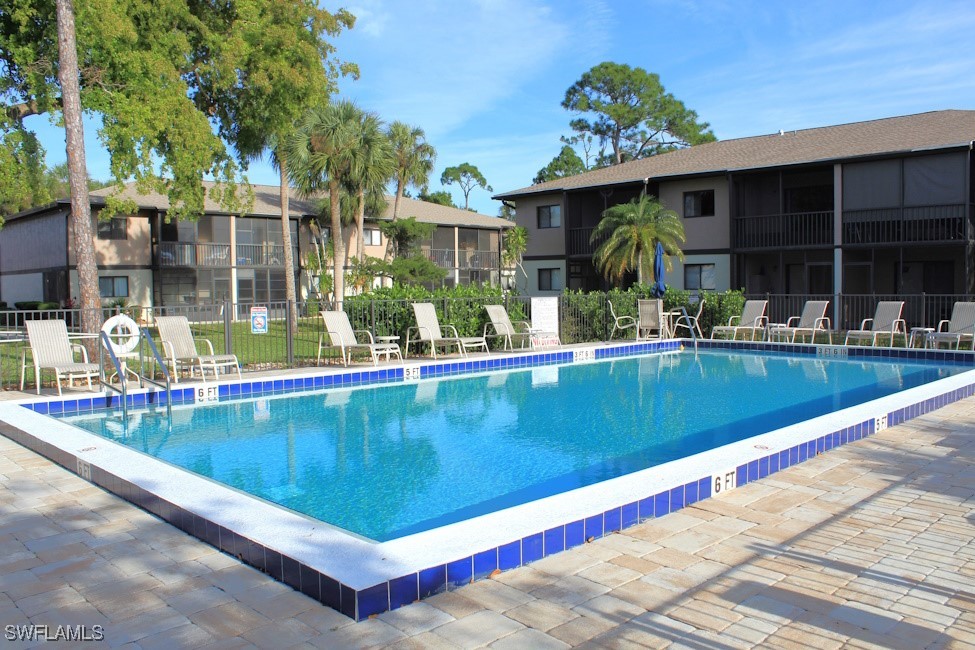 1221 Barrett Road, Unit 905 North Fort Myers, FL 33903 - Photo 21 of 22 a view of a house with a swimming pool
