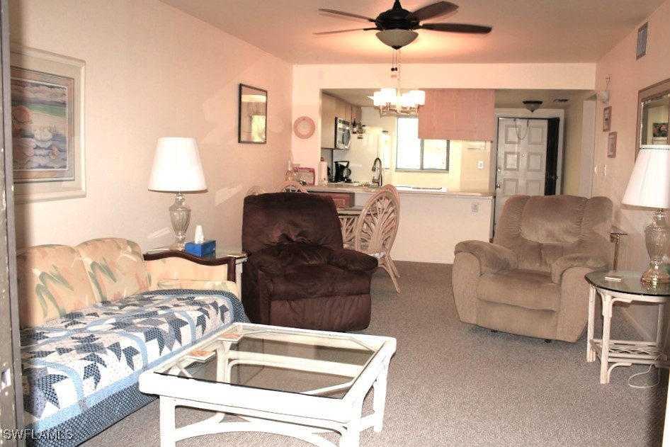 1221 Barrett Road, Unit 905 North Fort Myers, FL 33903 - Photo 7 of 22 a living room with furniture and a wooden floor