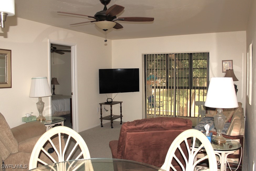 1221 Barrett Road, Unit 905 North Fort Myers, FL 33903 - Photo 8 of 22 a living room with furniture and a flat screen tv