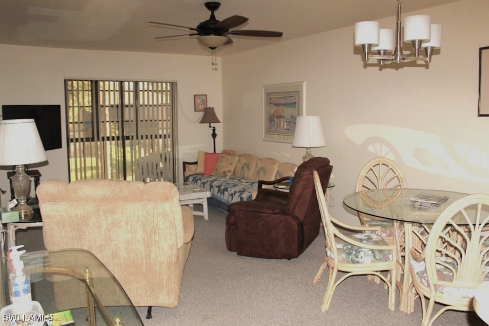 1221 Barrett Road, Unit 905 North Fort Myers, FL 33903 - Photo 9 of 22 a living room with furniture a flat screen tv and a large window